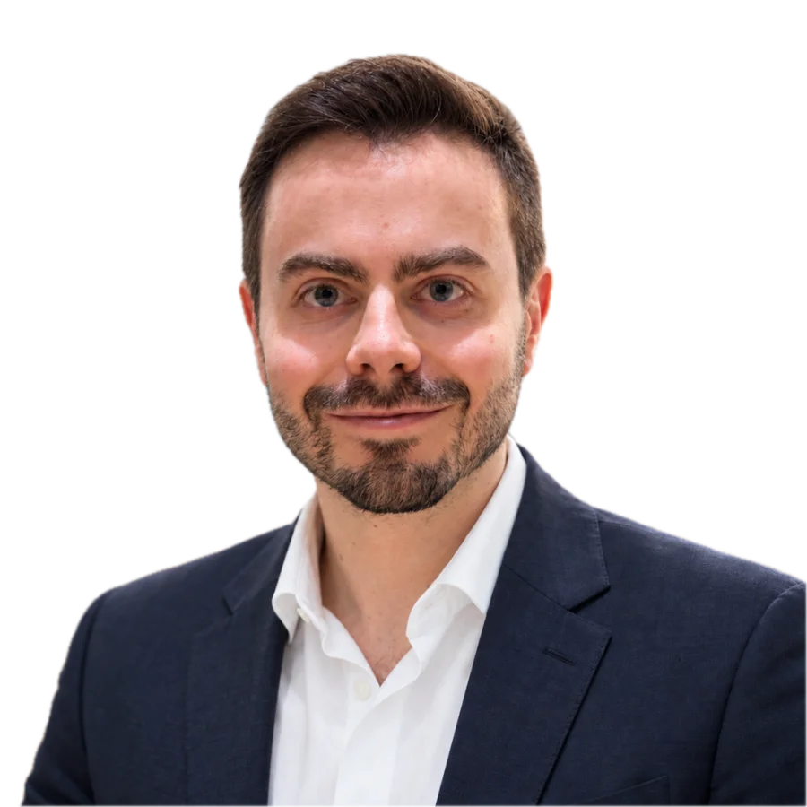Portrait of Nuno Mendes in a navy blazer and white shirt.